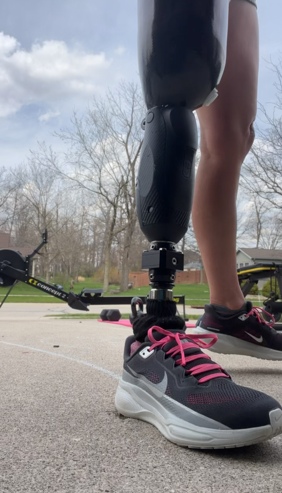 Adaptive athlete with a running prosthetic training outdoors